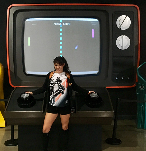 Rydia at the National
                            Video Game Museum with a giant Pong game