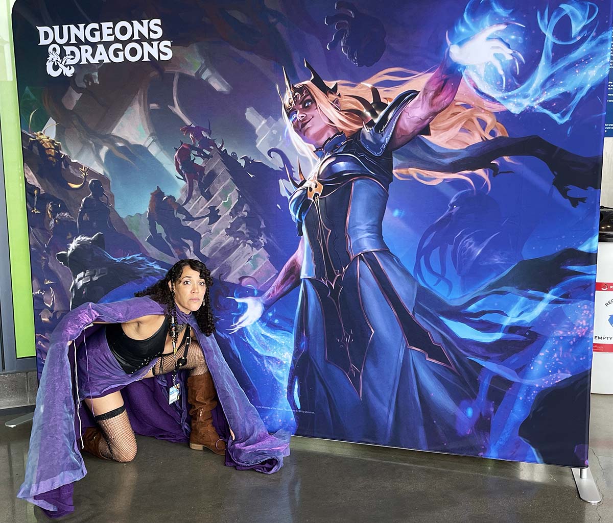 Rydia as her half-elf Sylkenblade
                                  from, clad in shimmery purple cloak,
                                  at Gen Con